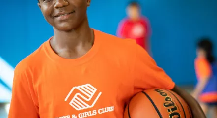 Kid holding a basket ball